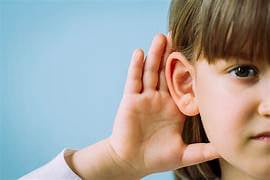 Young girl cupping ear to listen better – Audifort natural hearing support